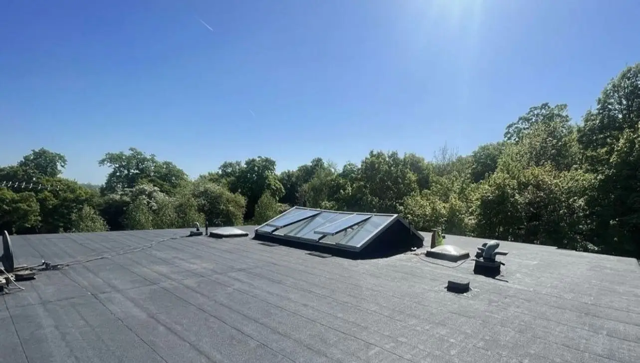 Wide London flat roof with rooflights following a full covering replacement