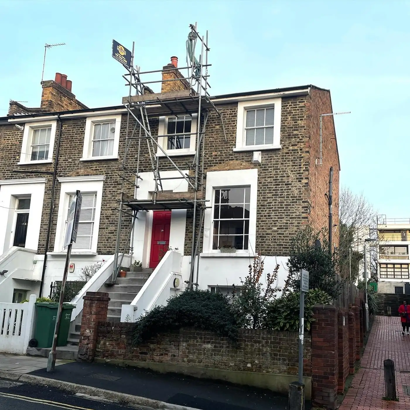 Scaffolded period London property with chimney stacks being prepared for works